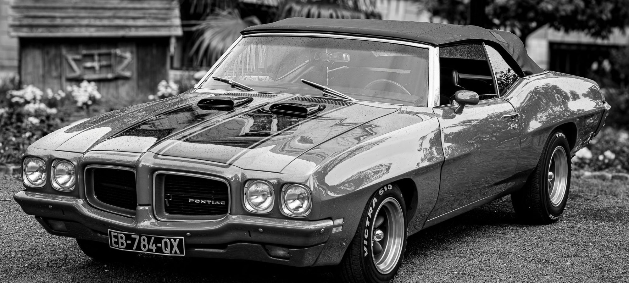 Monochrome photo of a vintage Pontiac GTO classic car by Jean Marc Bonnel via pexels